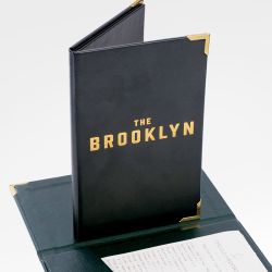 Black leather bill presenter with gold corners shown closed and open, displaying interior receipt pocket.